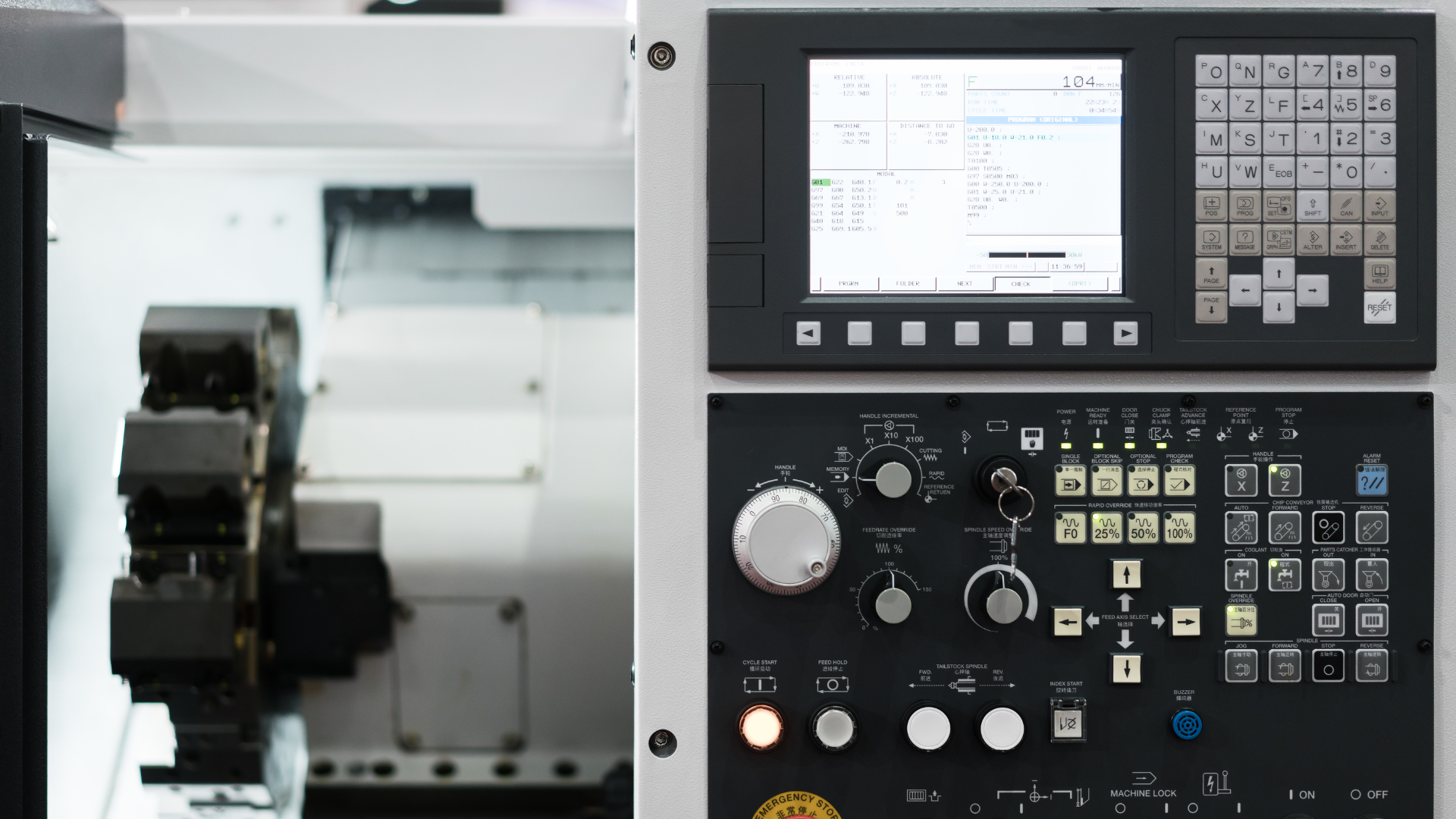 A machine is sitting next to a control panel.