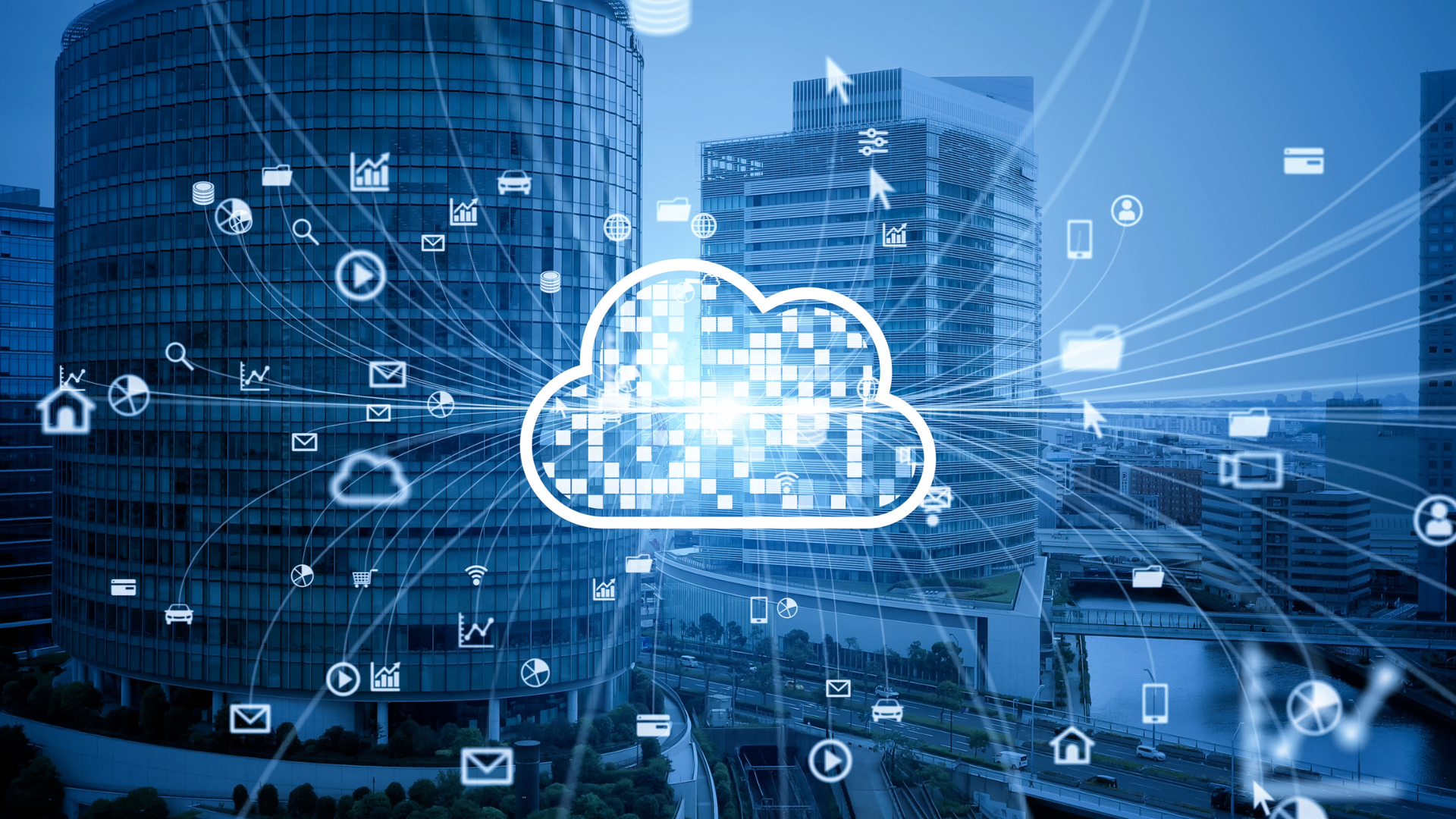 A cloud surrounded by icons in front of a city skyline.