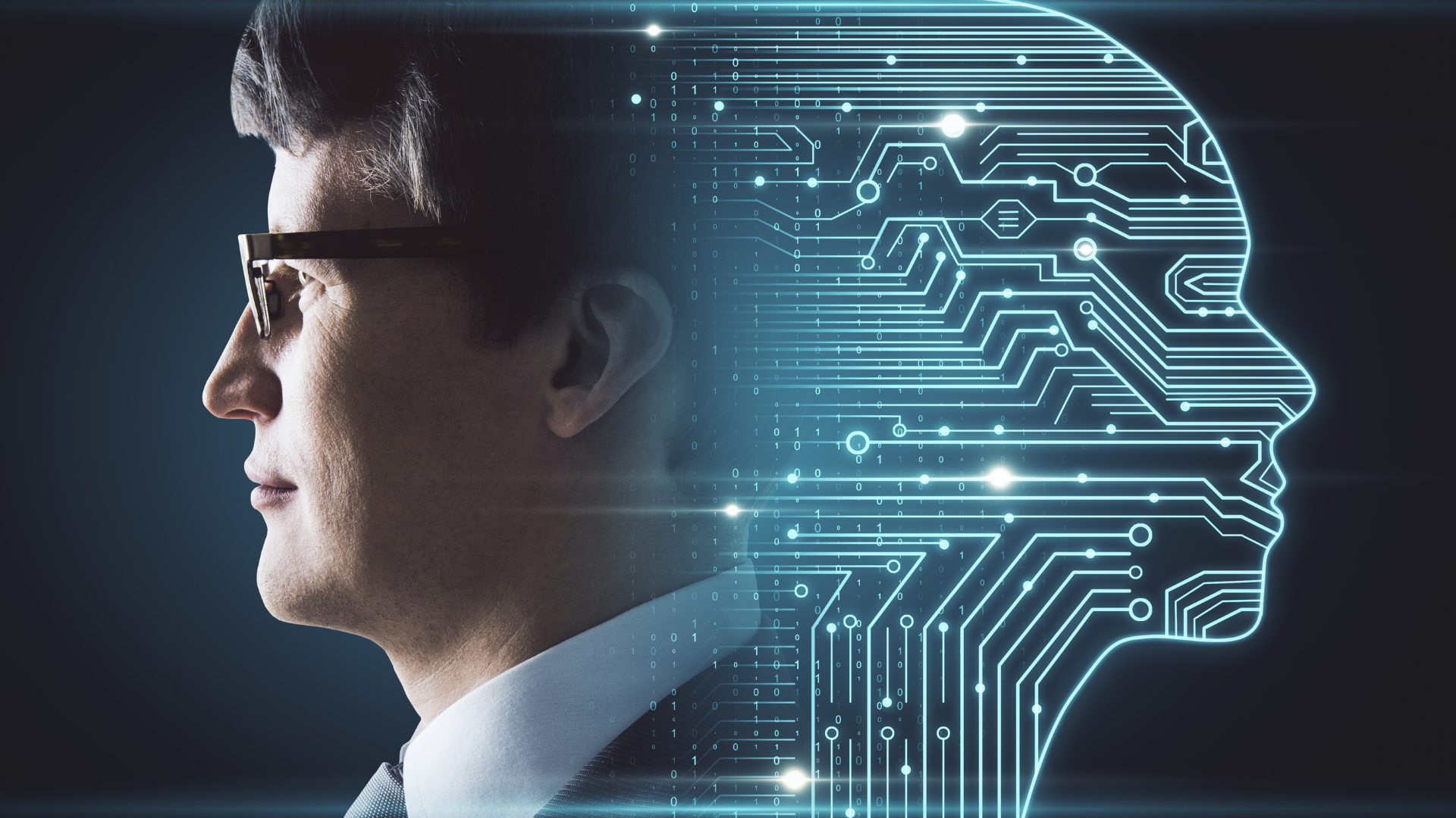 A man in a suit and tie with a circuit board coming out of his head.