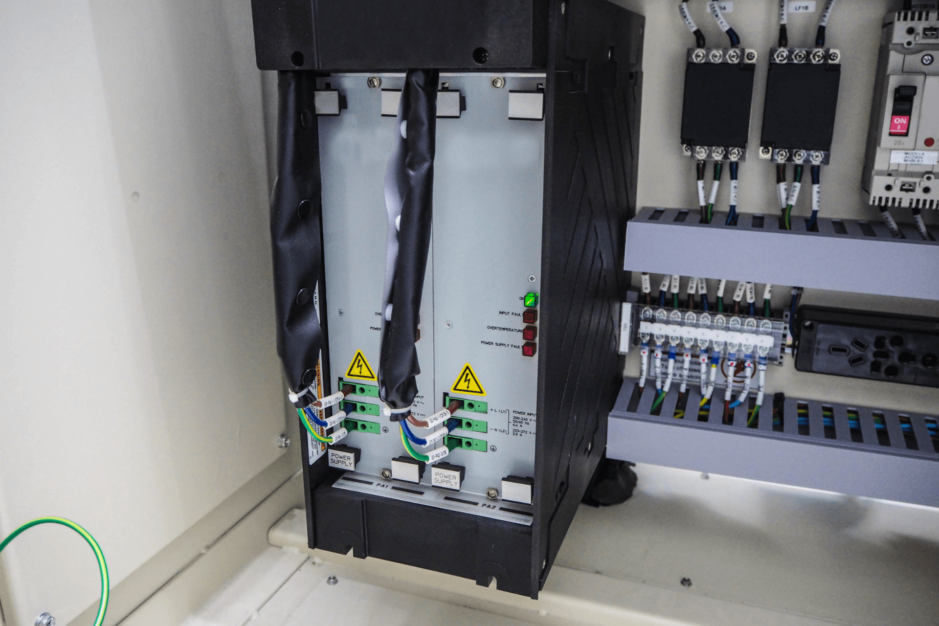 A electrical box with a lot of wires coming out of it