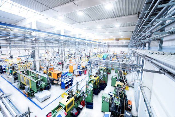 A factory filled with lots of machinery and people.