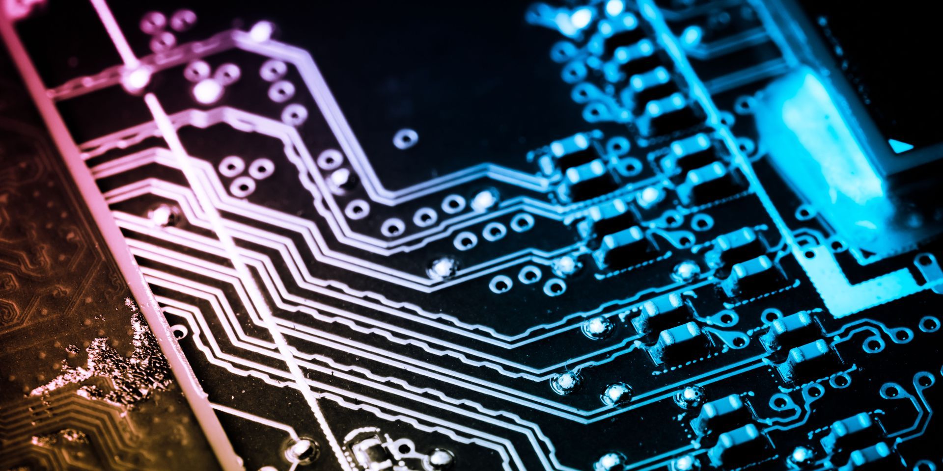 A close up of a computer motherboard with a blue light coming out of it.