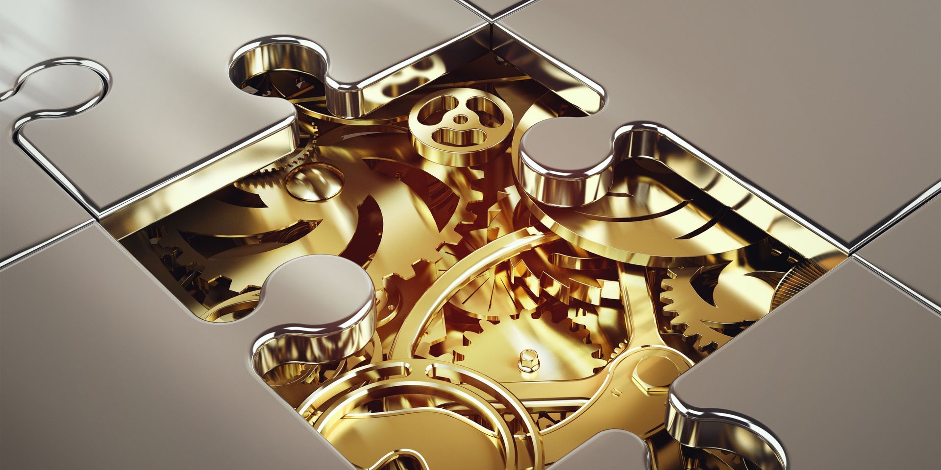 A close up of a gold puzzle piece with gears on it