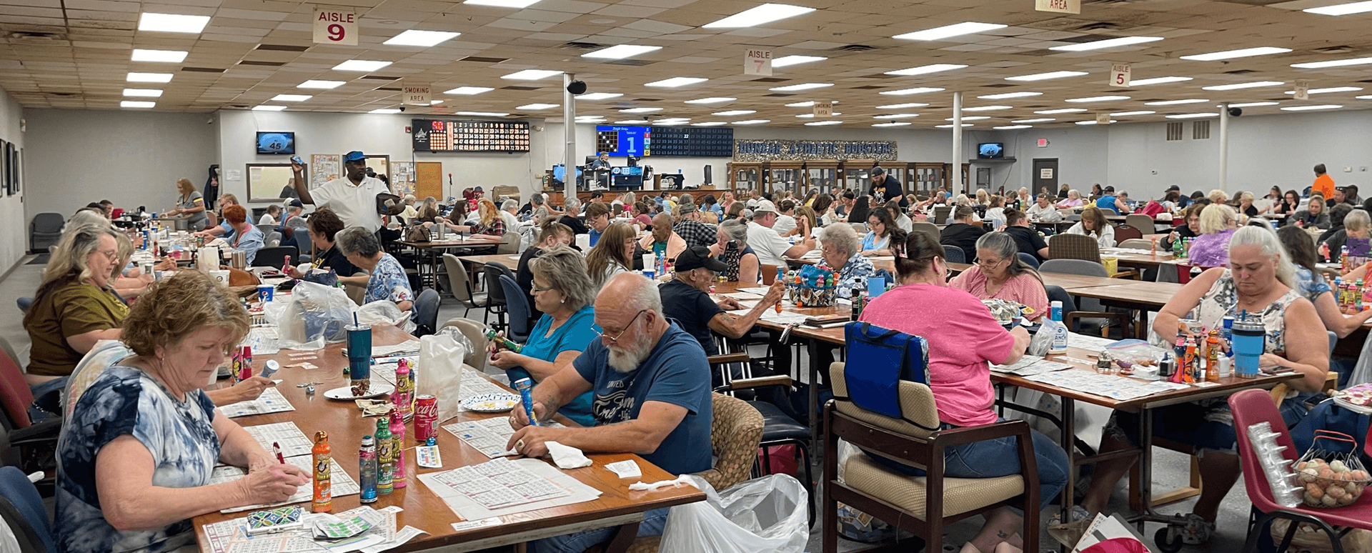 People playing a Bingo game in a Bingo Hall