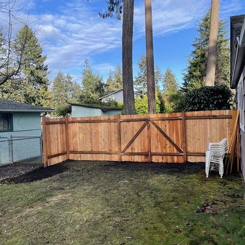 Wooden fence — Lakewood, WA — DOVE LANDSCAPING Wooden fence — Lakewood, WA — DOVE LANDSCAPING