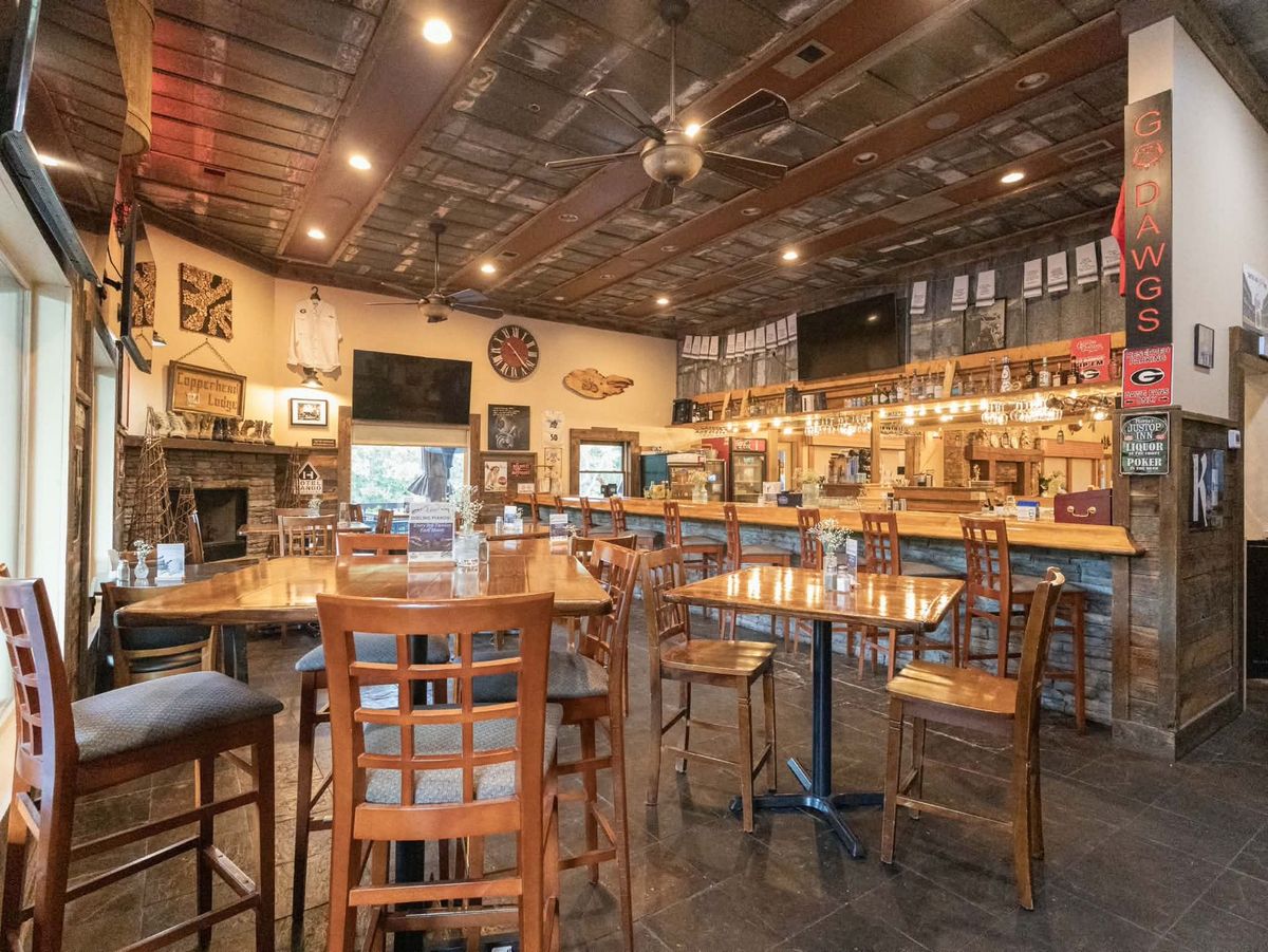 Copperhead Lodge dining and bar area with rustic decor