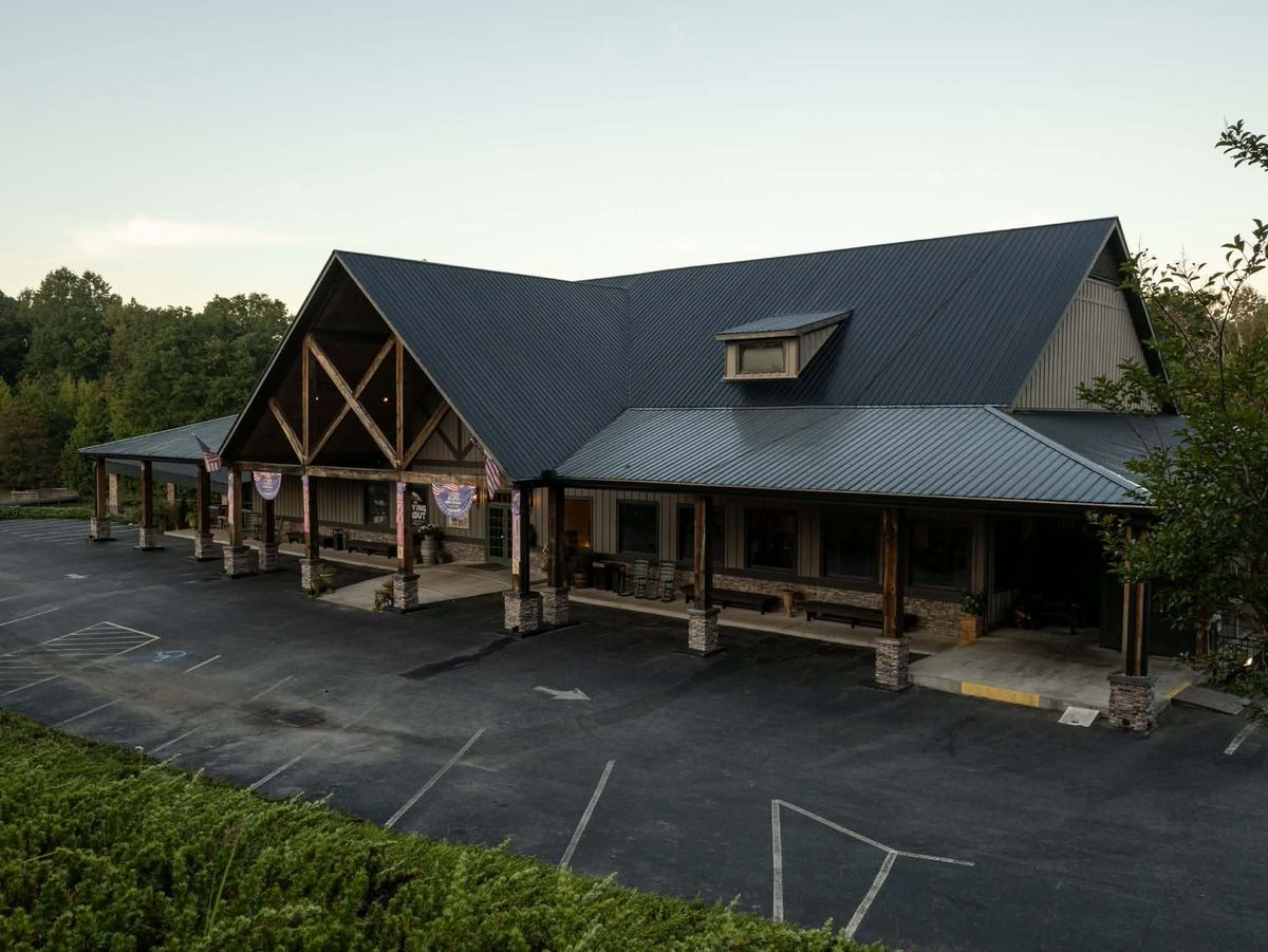 The Flying Trout lodge exterior glowing at dusk