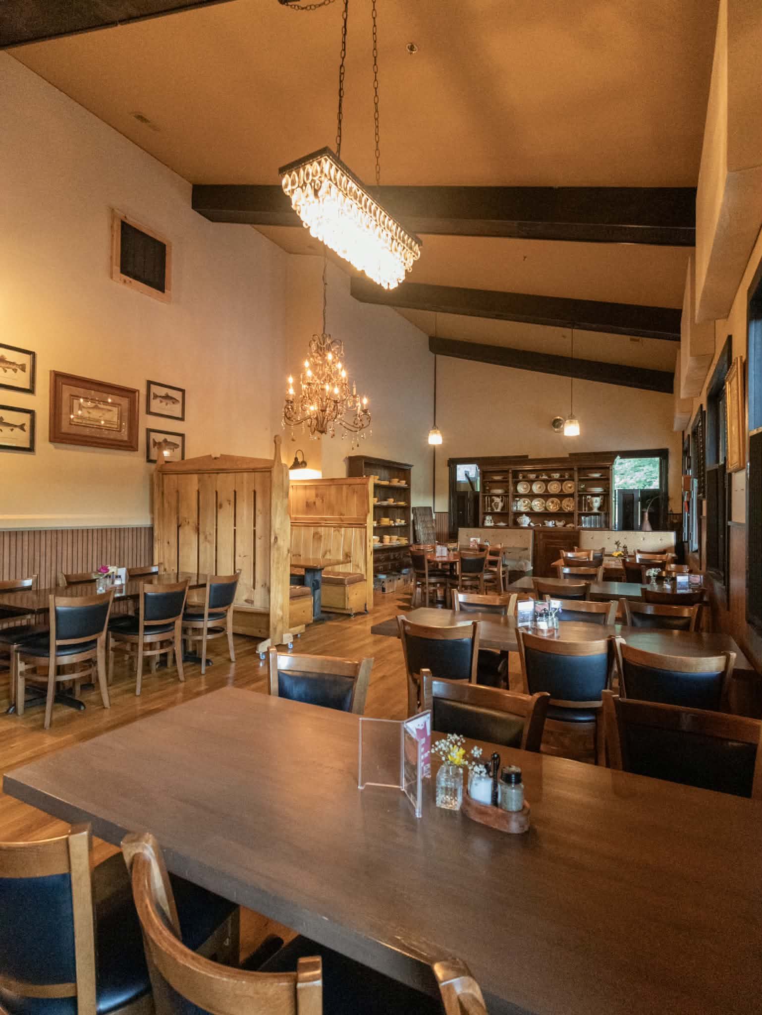 Rustic upscale restaurant dining room with a chandelier