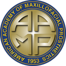 Emblem of the American Academy of Maxillofacial Prosthetics with gold letters and blue border.