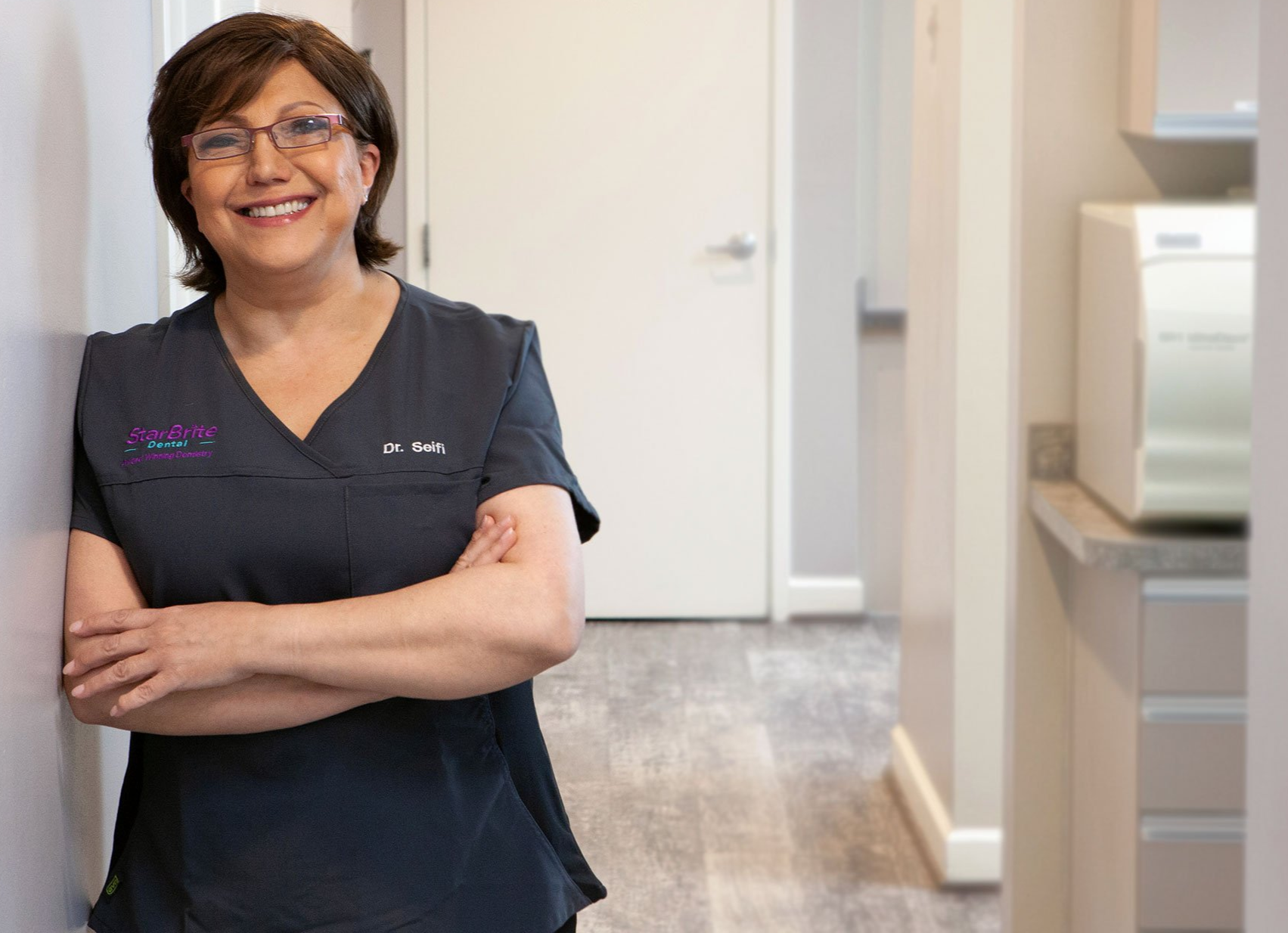 close up of woman about to place invisalign