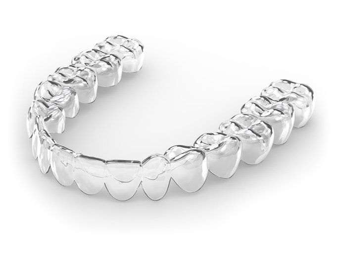close up of woman about to place invisalign