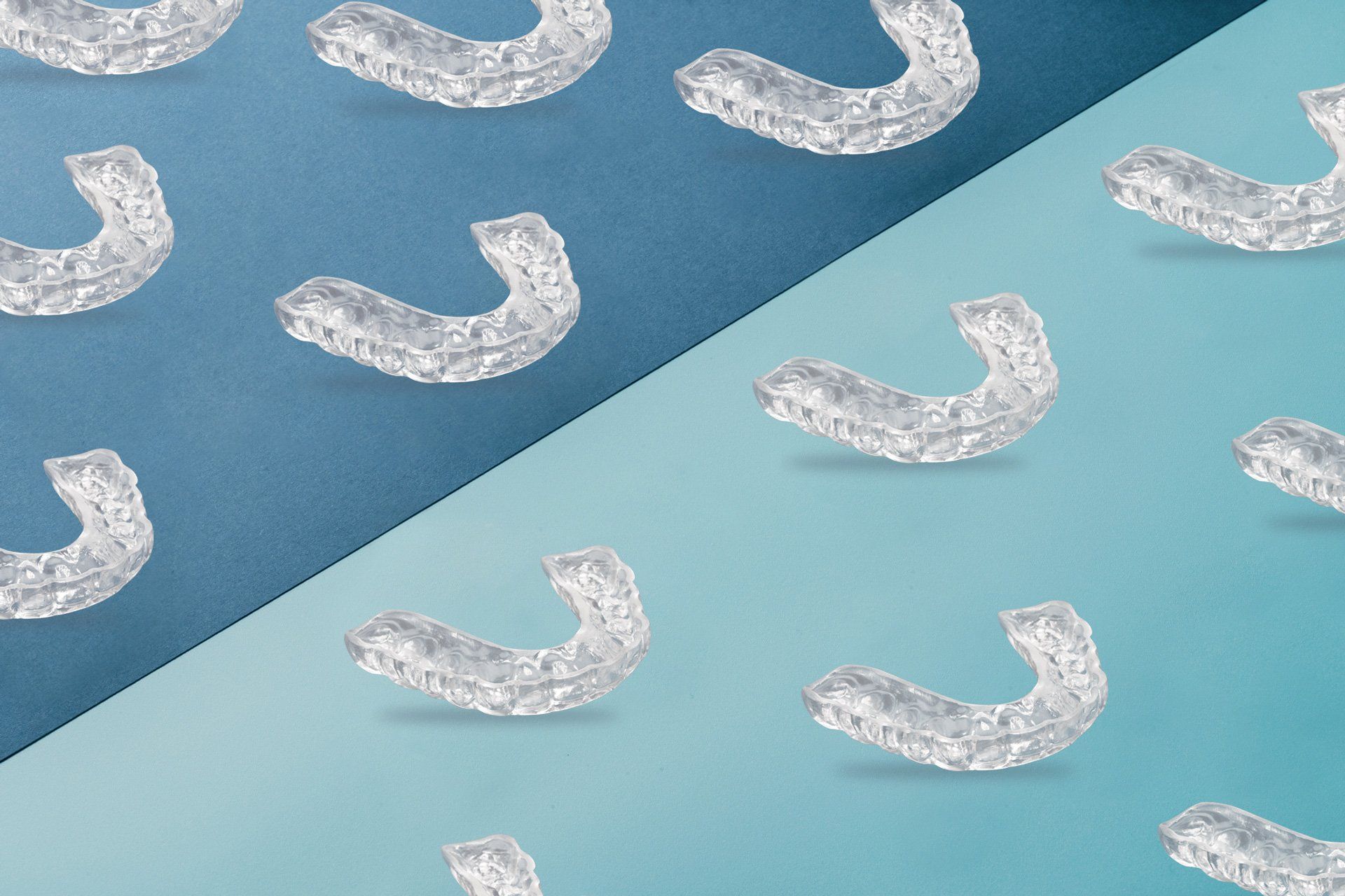 Rows of clear night guards on a blue background