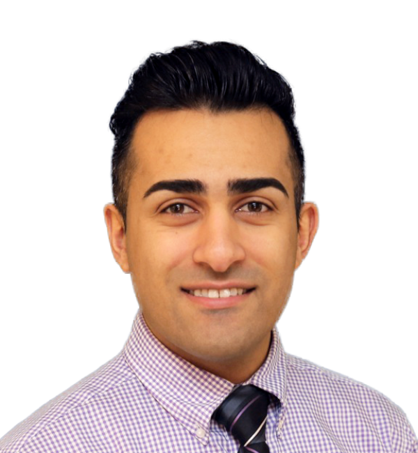 A man in a plaid shirt and tie is smiling for the camera