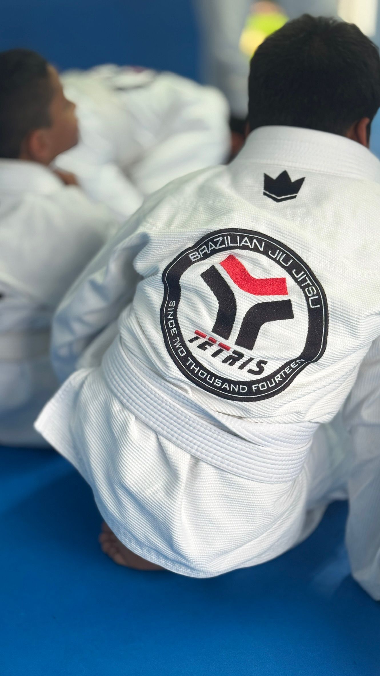 Students drilling Brazilian Jiu-Jitsu technique at Tetris Jiu-Jitsu in Orlando, FL for fitness.