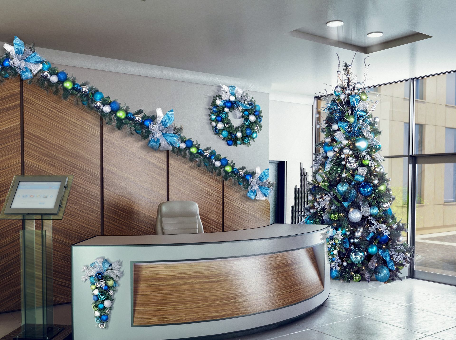 Festively decorated lobby with a lit Christmas tree, wreath, and blue garlands around the reception desk