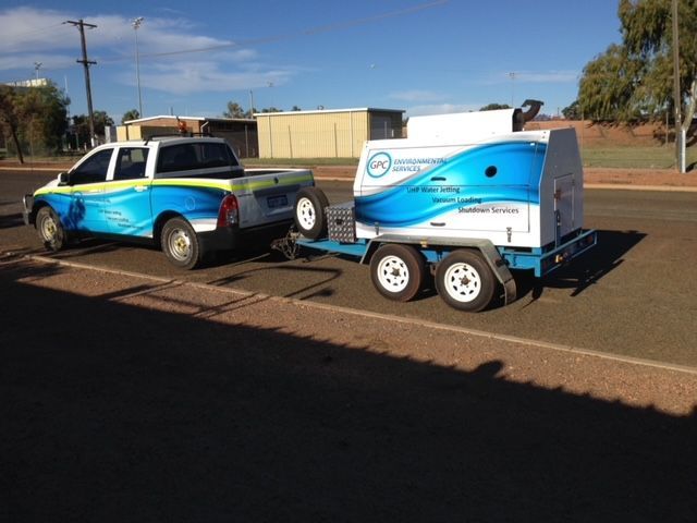 A pickup truck with a trailer attached to it