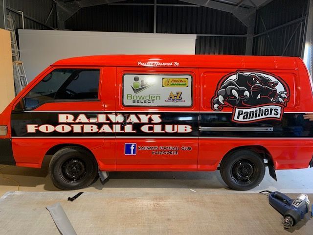 A red van with the word panthers on it