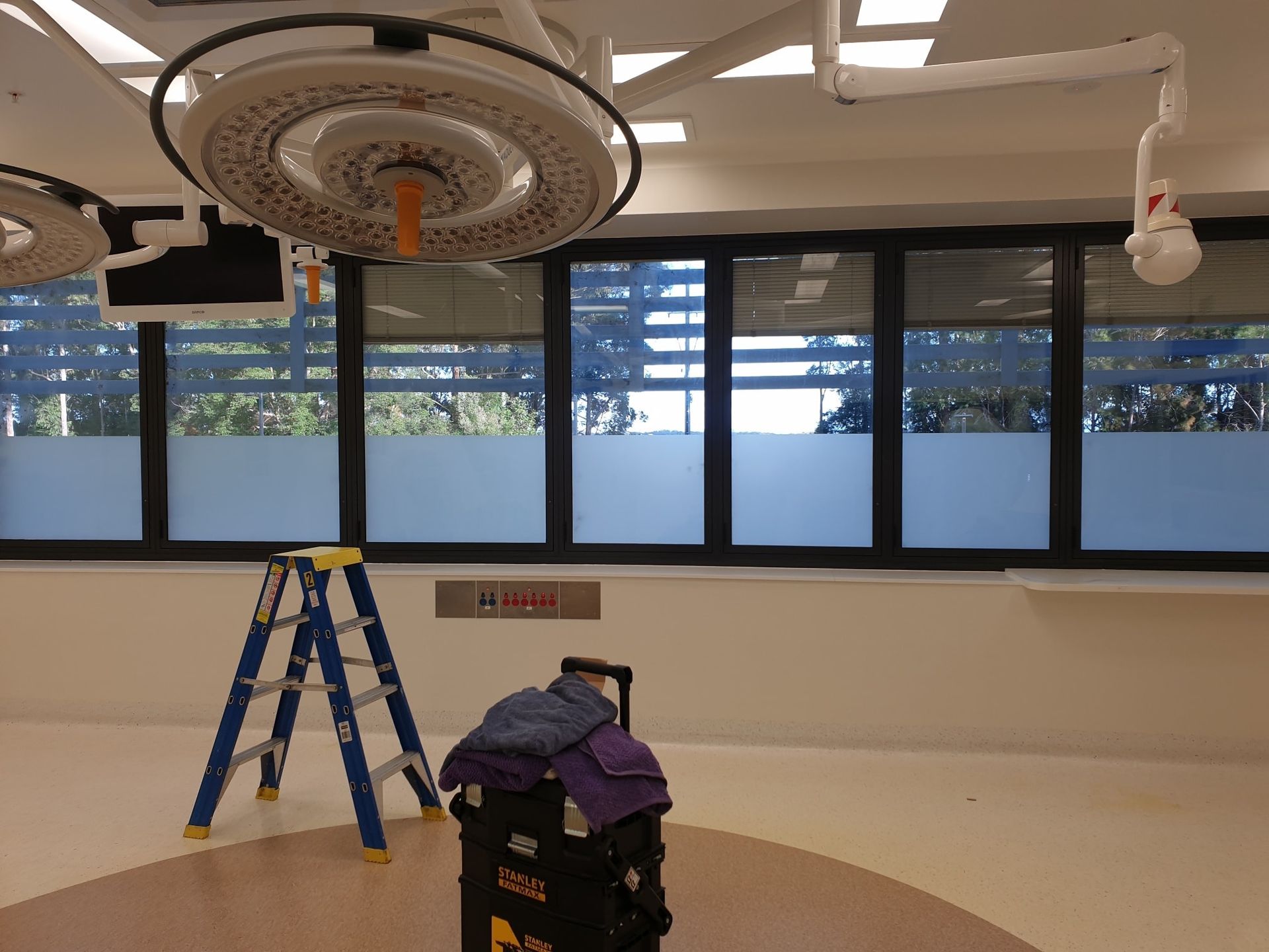 A Room With a Lot of Windows being tinted — PJ Tinting In Wauchope, NSW