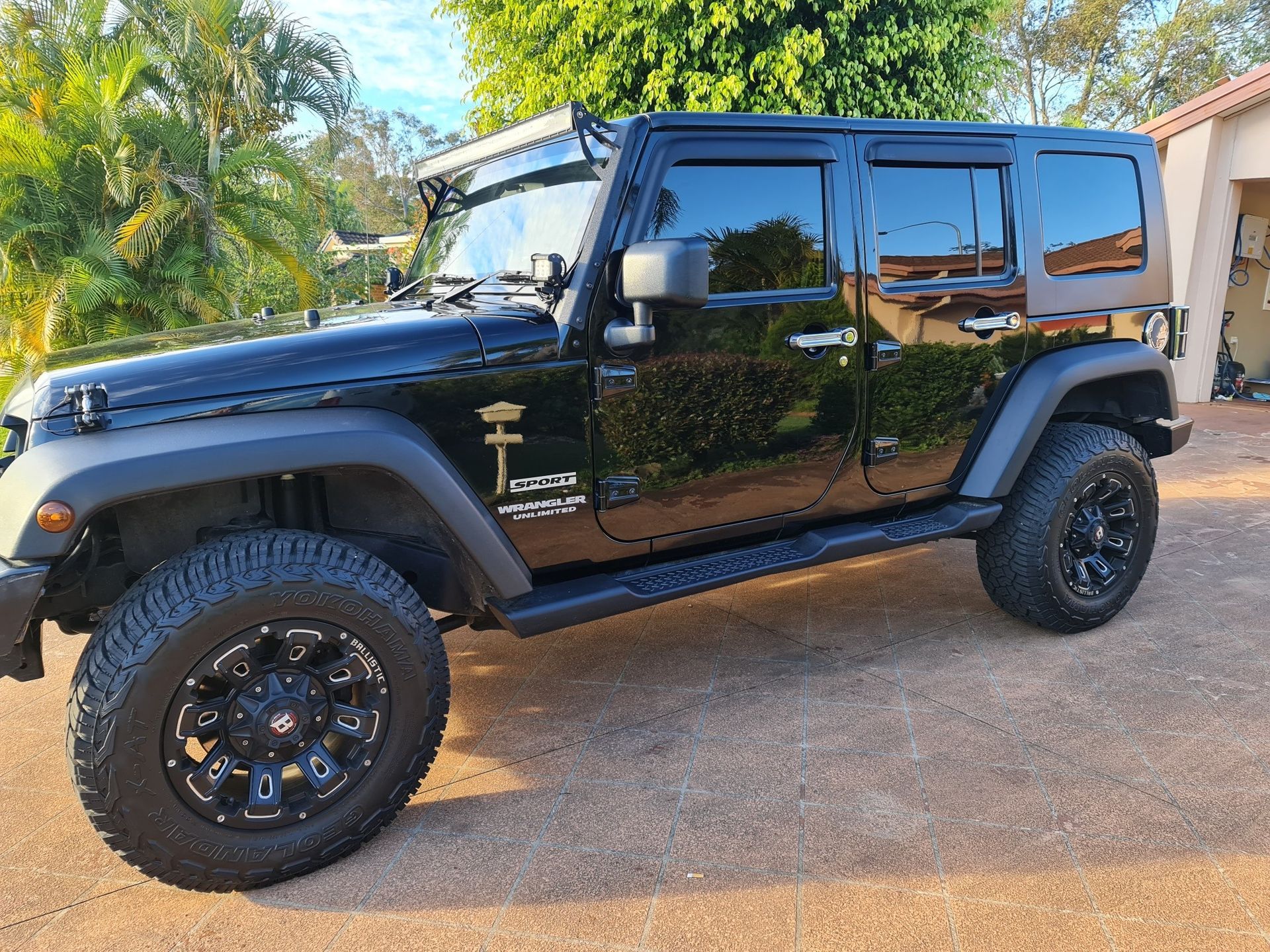 A black 4WD car With a Tinted windows — PJ Tinting In Port Macquarie, NSW