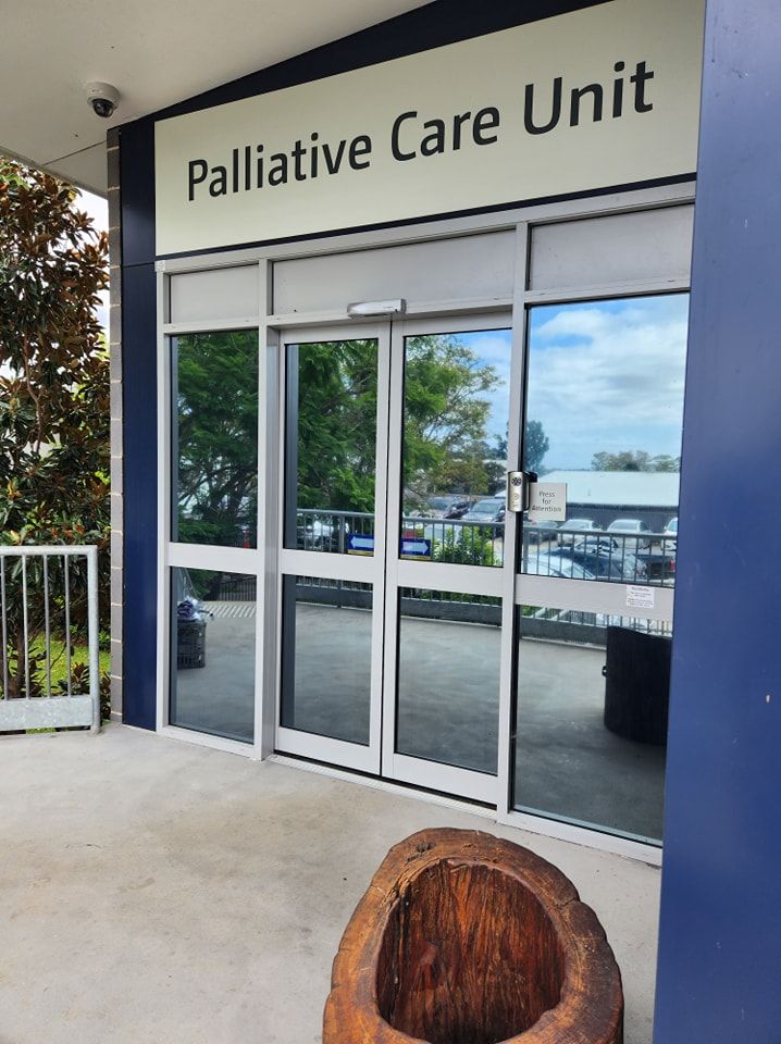 Entrance of a building with glass windows and sliding doors — PJ Tinting In Port Macquarie, NSW