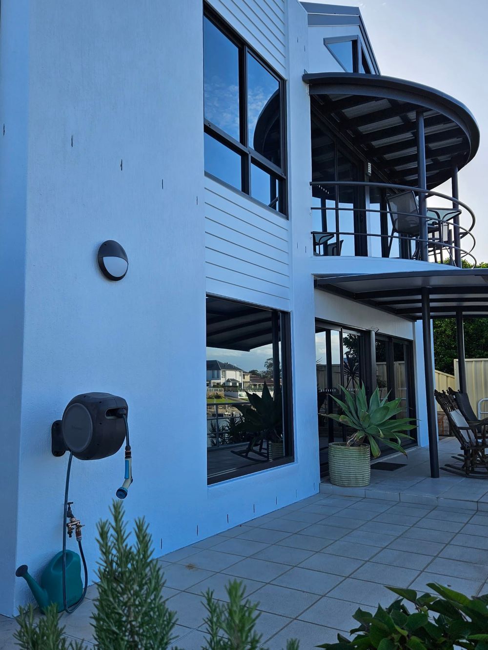 A Large Blue Building With a Tinted Window — PJ Tinting In Port Macquarie, NSW
