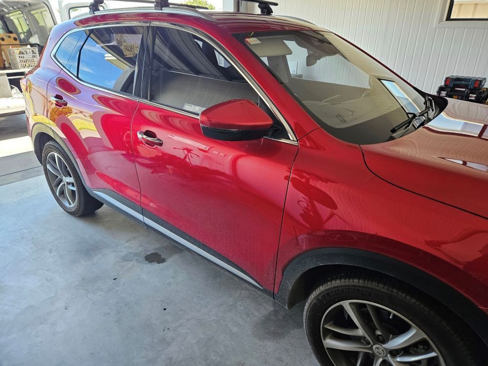 A Red Car is Parked in a Garage — PJ Tinting In Wauchope, NSW