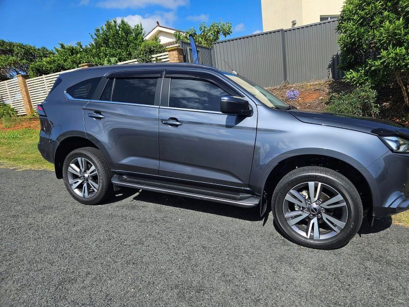 A Gray Suv is Parked on the Side of the Road — PJ Tinting In Wauchope, NSW