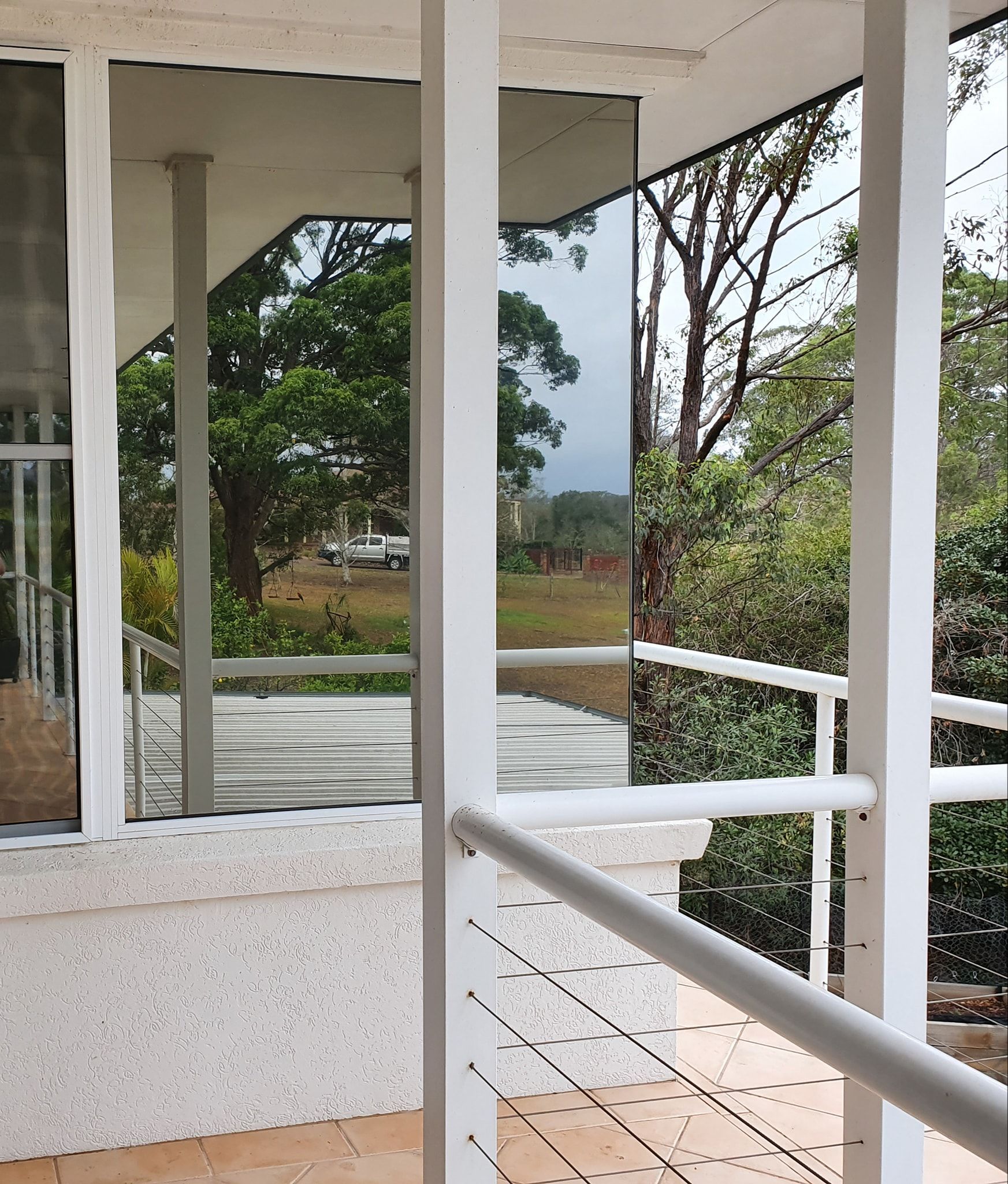 Veranda of a white house with tinted windows — PJ Tinting In Port Macquarie, NSW
