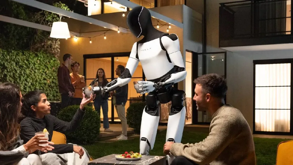 Tesla robot serving snacks to people in a backyard setting.