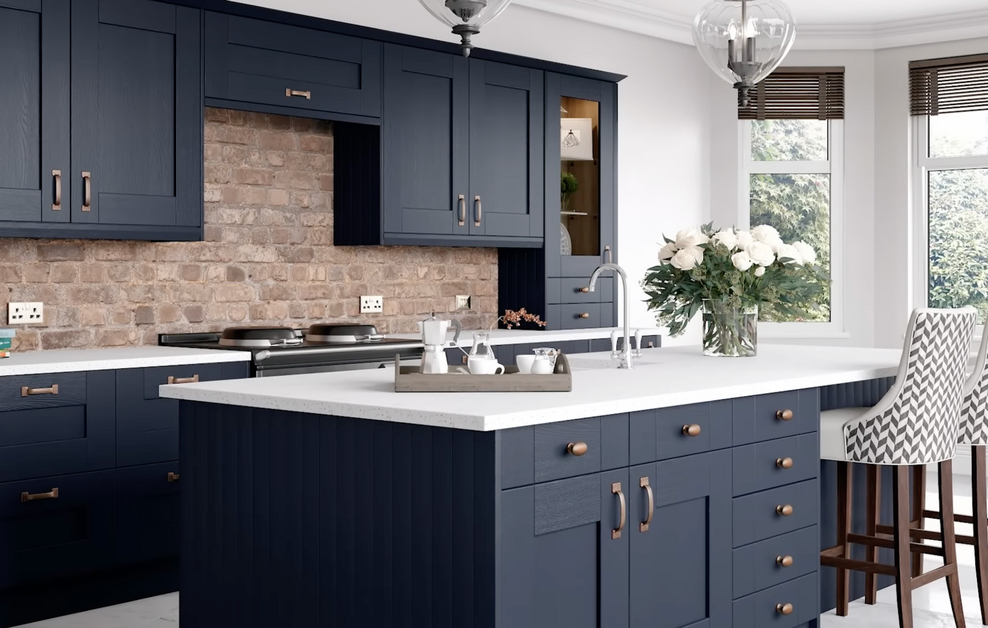 Modern navy and white kitchen with island, marble counters, brick backsplash, and patterned barstools