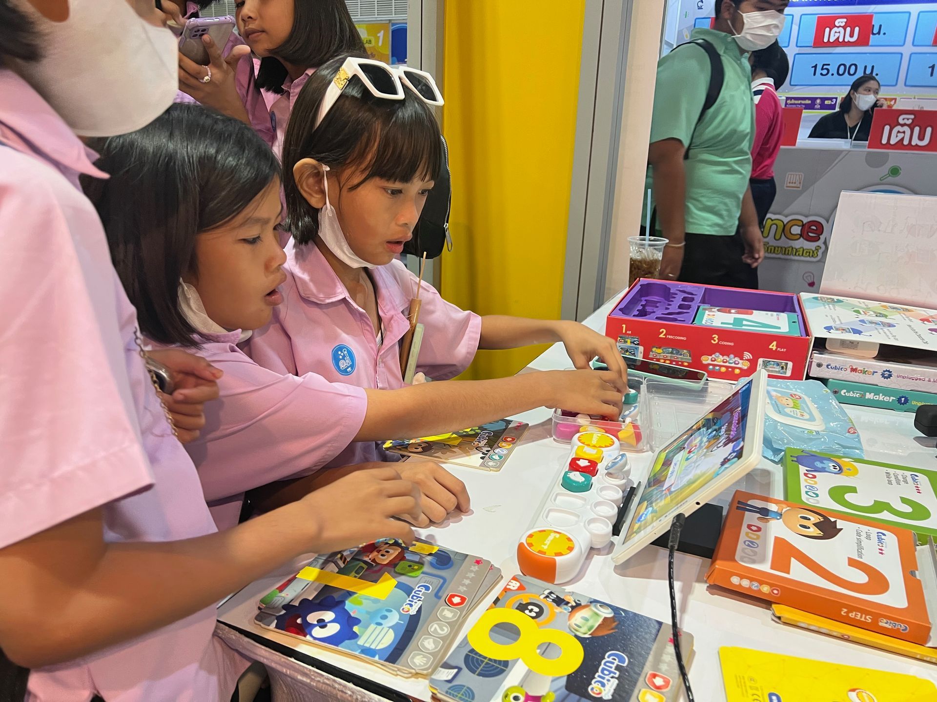 A group of children are playing with toys on a table.