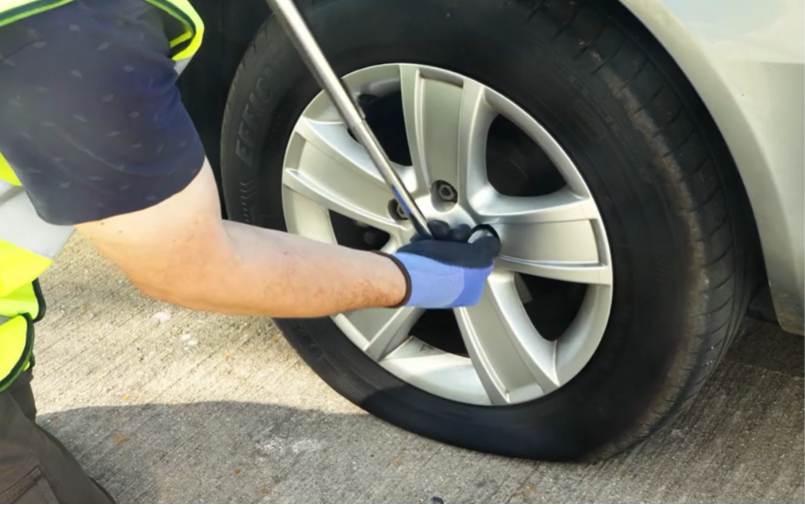Roadside Assistance professional performing a battery boost near Bobcaygeon