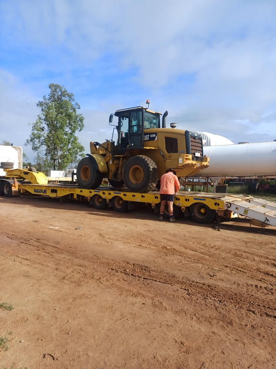 A Bulldozer is Sitting on Top of a Trailer on a Dirt Road — Advanced Industry Training In South Townsville, QLD