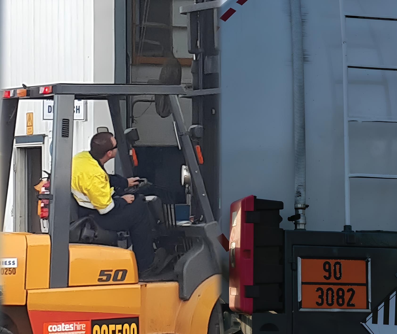 A Man is Driving a Forklift With the Number 50 on It — Advanced Industry Training In South Townsville, QLD