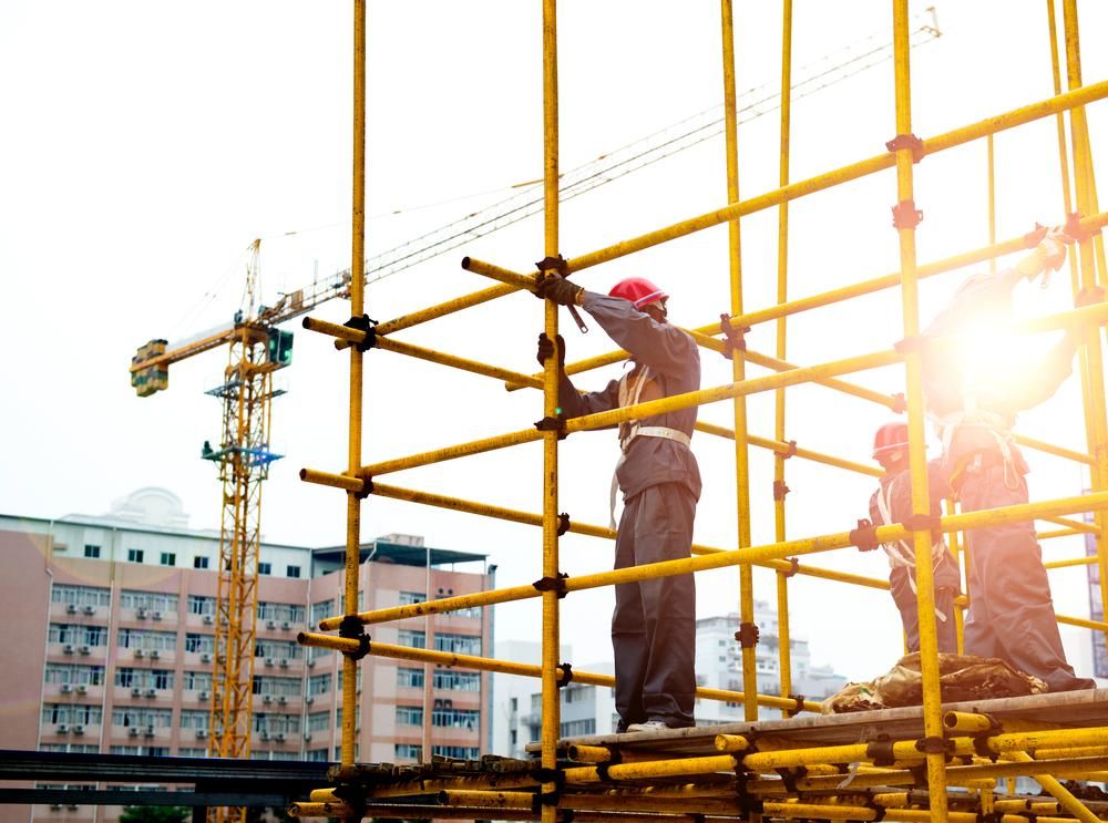 Workers Are Working on a Scaffolding at a Construction Site — Advanced Industry Training In Mackay, QLD