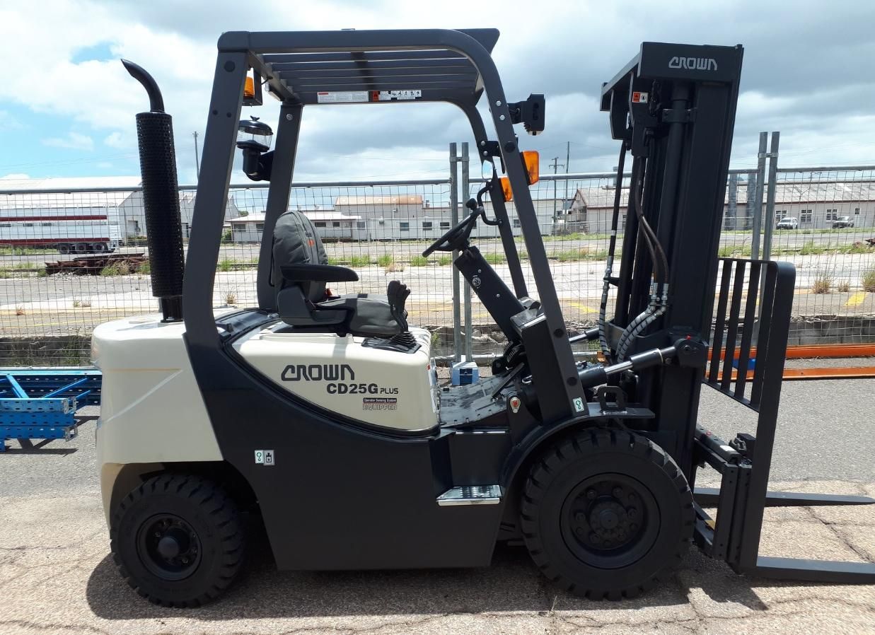 A Crown Forklift is Parked on the Side of the Road — Advanced Industry Training In Mackay, QLD