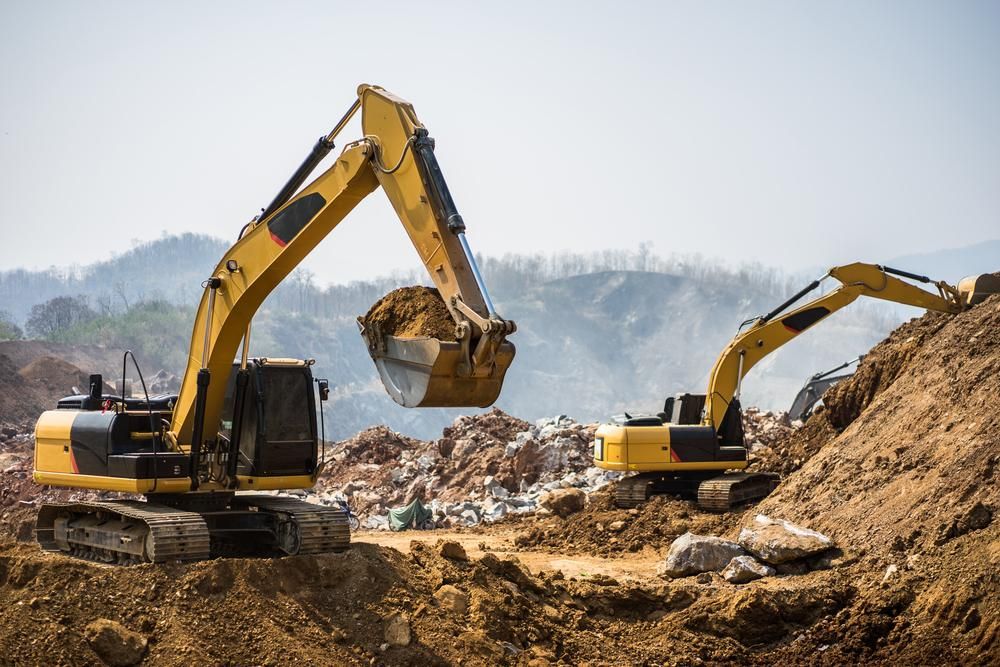 Two Excavators Are Working on a Construction Site — Advanced Industry Training In Mackay, QLD