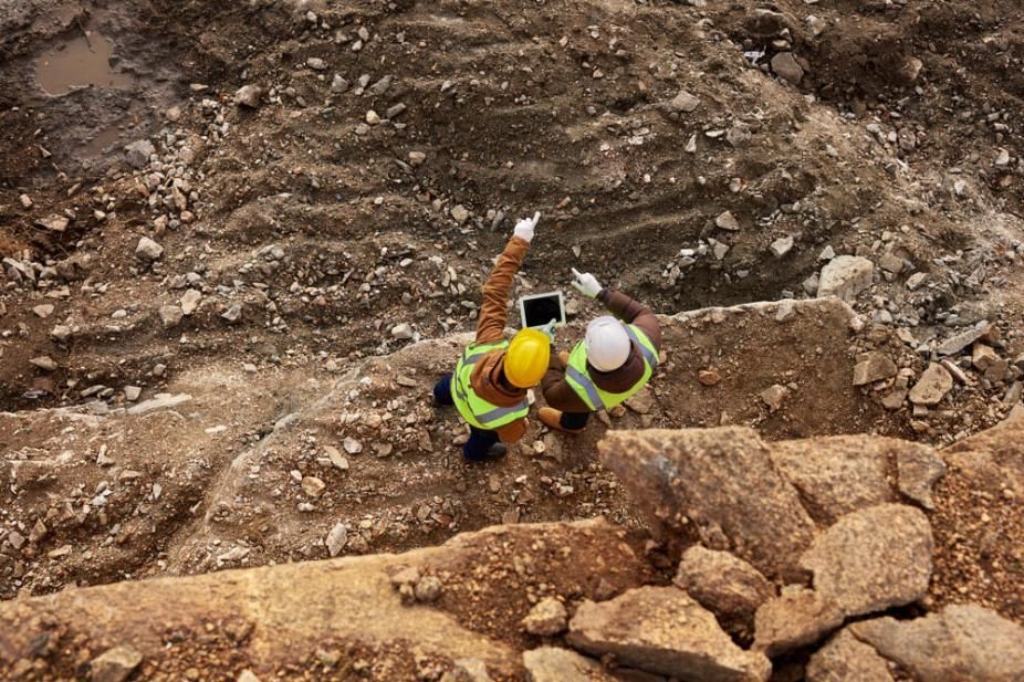 Workers Are Standing on Top of a Rocky Hill — Advanced Industry Training In South Townsville, QLD