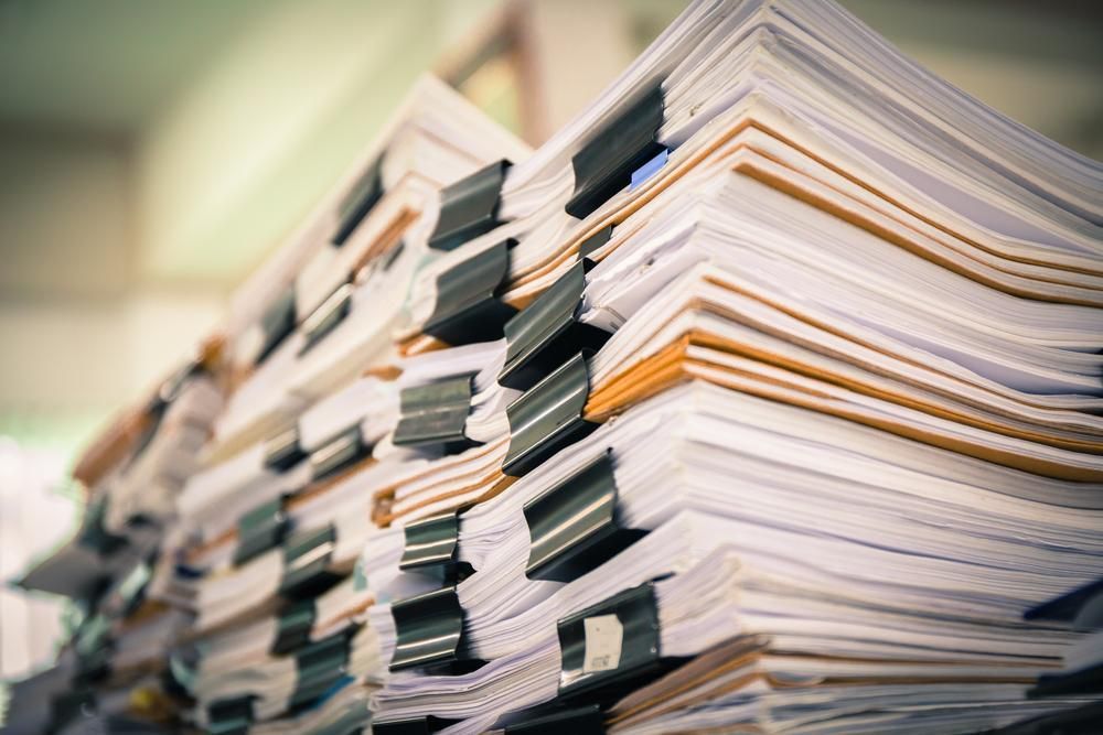 A Stack of Papers is Sitting on Top of Each Other on a Shelf — Advanced Industry Training In South Townsville, QLD