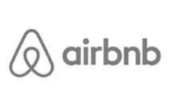 A black and white airbnb logo on a white background