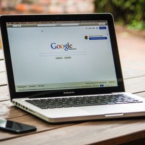 A laptop is open to a google page