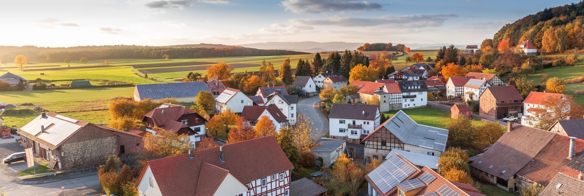 An aerial view of a small town in the middle of a field.