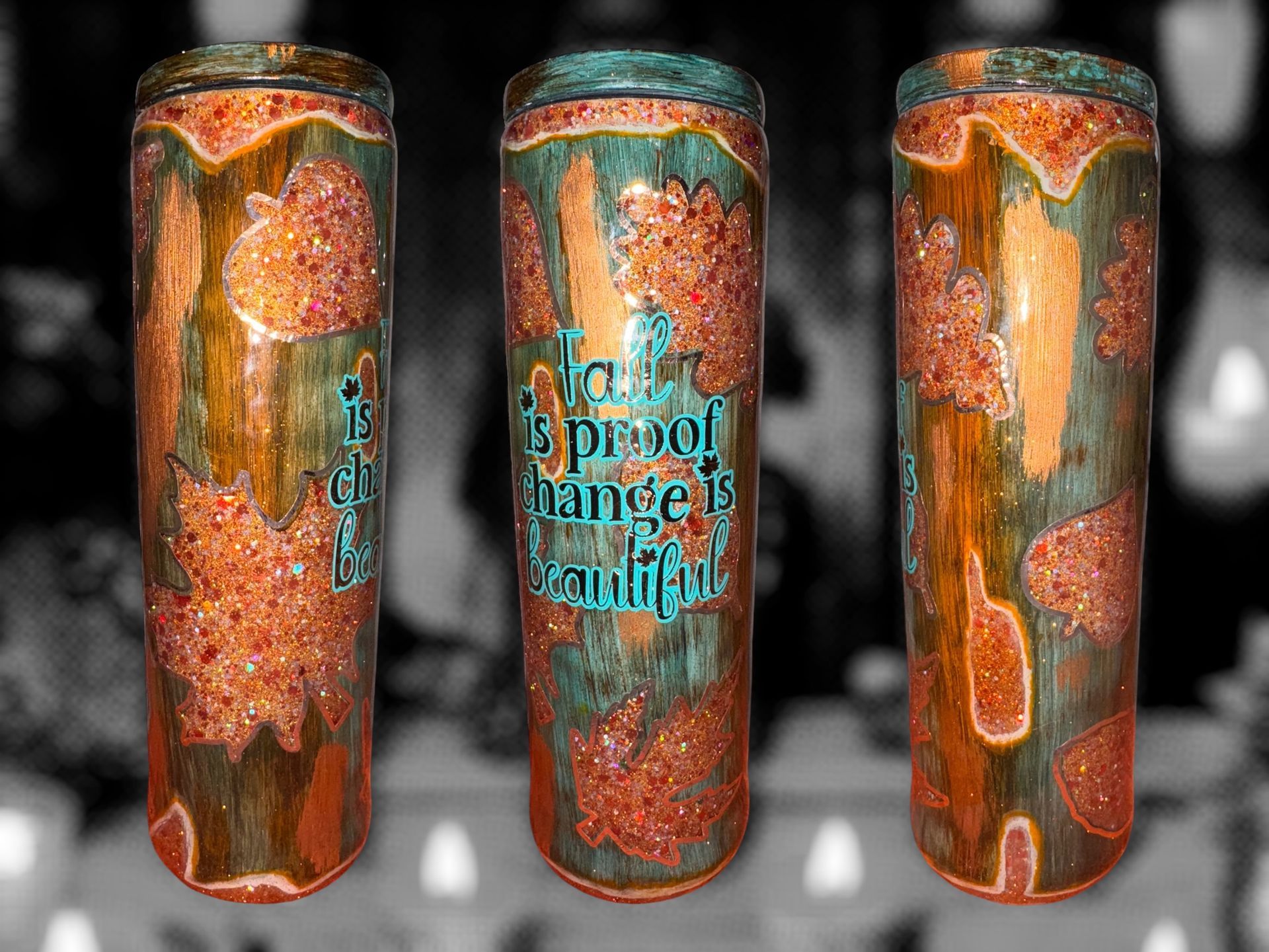 Three cylindrical tumblers with copper and teal color scheme; 