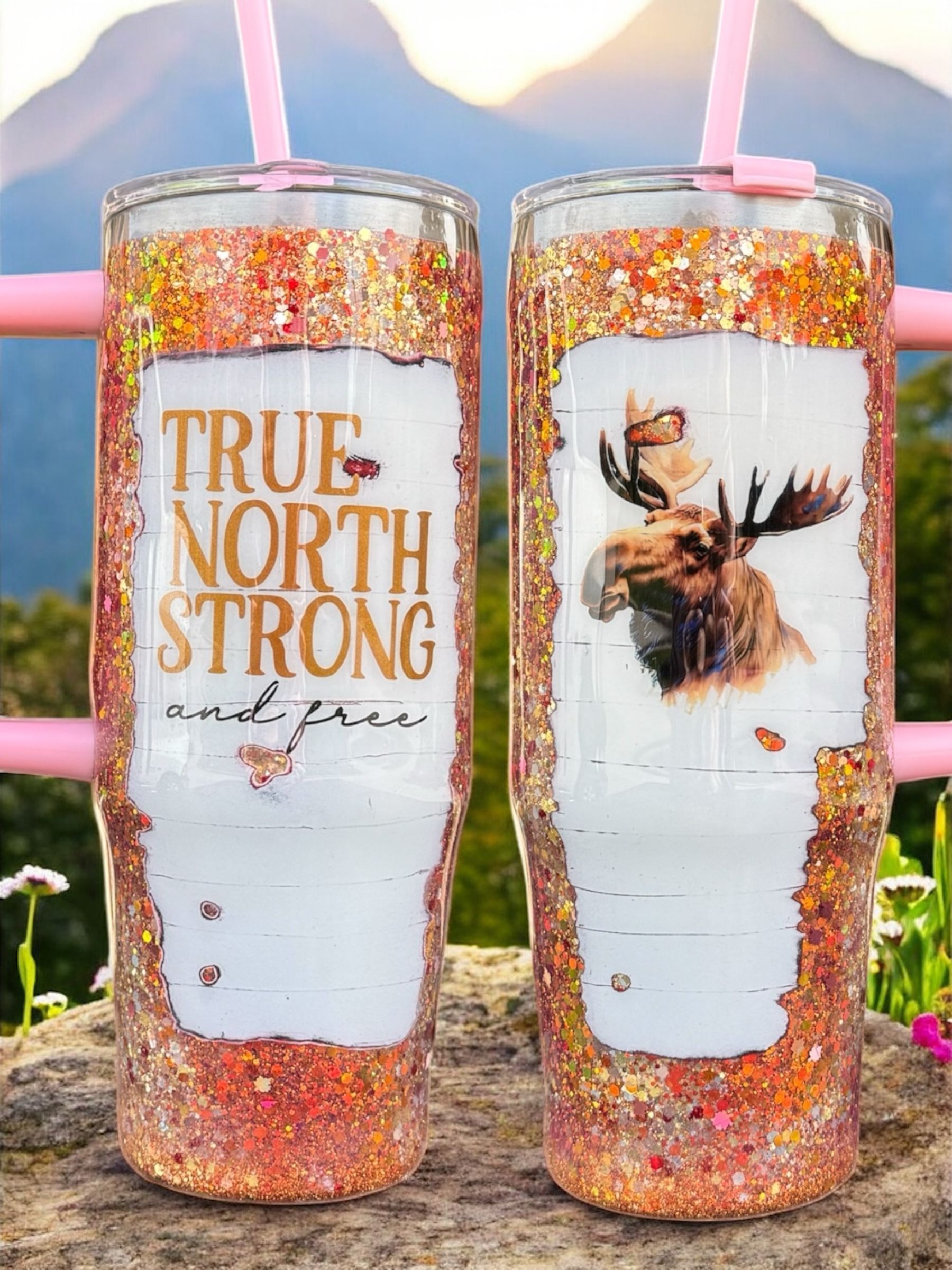 Two glitter-covered tumblers with moose design; 