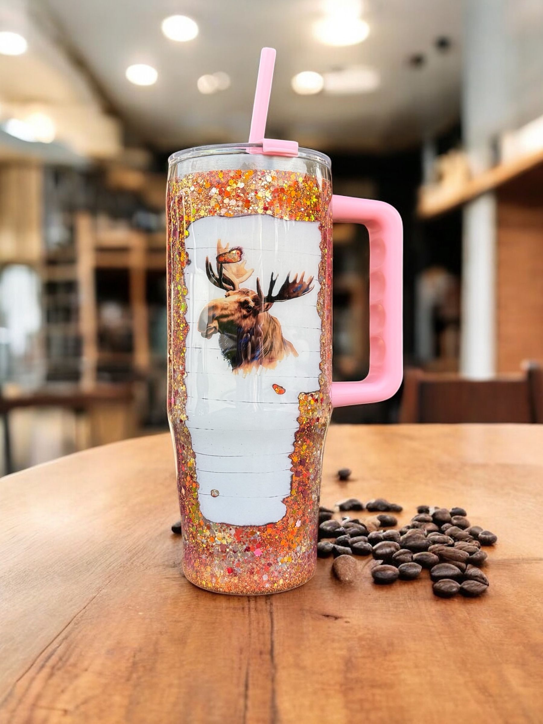Two glitter-covered tumblers with moose design; 