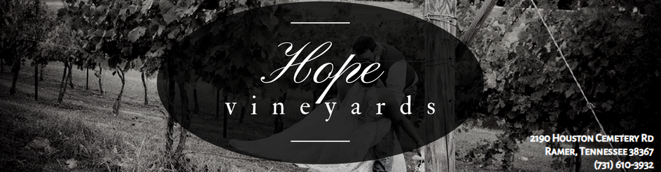 Black-and-white vineyard banner with the words “Hope vineyards” over a scenic landscape.