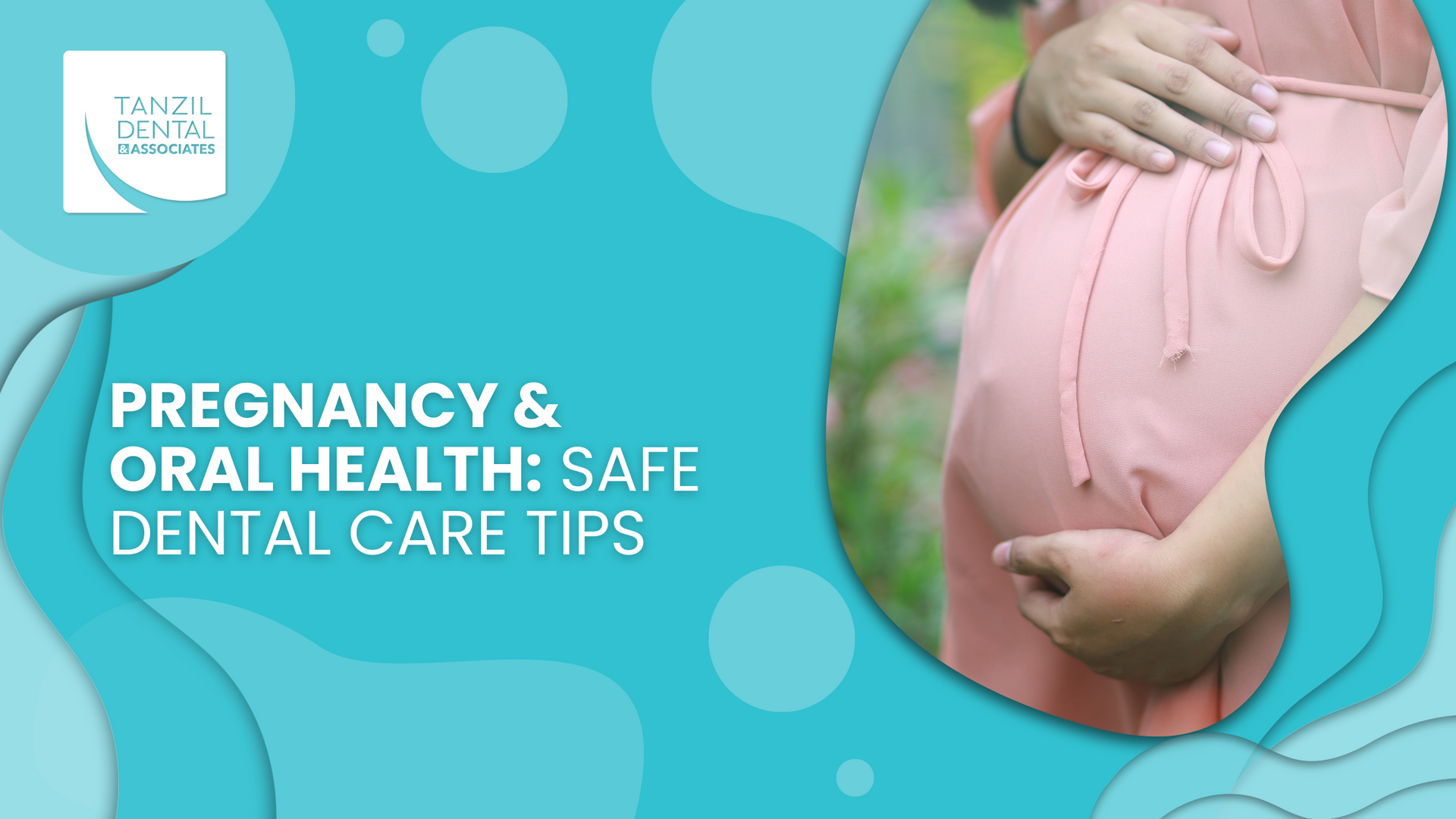 A pregnant woman in a pink dress is holding her belly.
