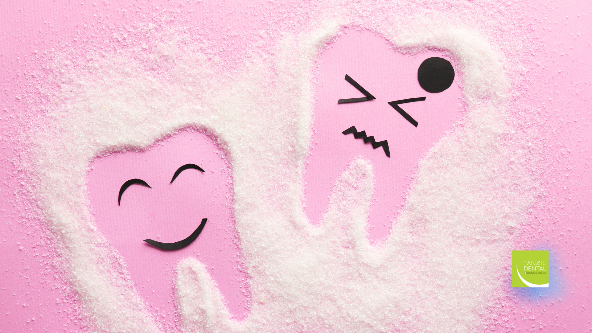 Two pink teeth with smiley faces drawn on them are made of sugar on a pink background.