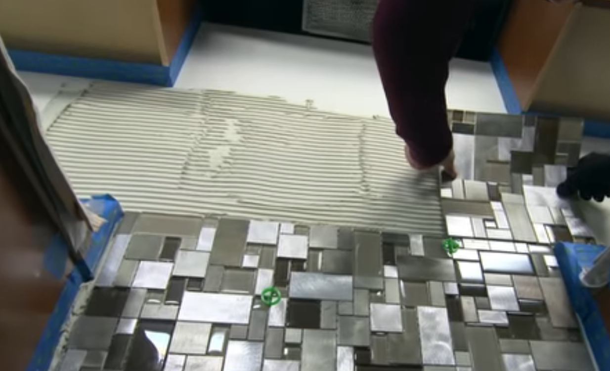 How do you prepare a wall for tile backsplash