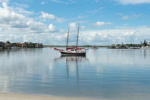Sailboat is Floating on Top of a Body of Water — Supercare Gold Coast in Paradise Point, QLD